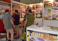 Mr Jim Yau (3rd from the left) from Full Well Packaging Company Limited is introducing the company's packaging solutions to the visitors.